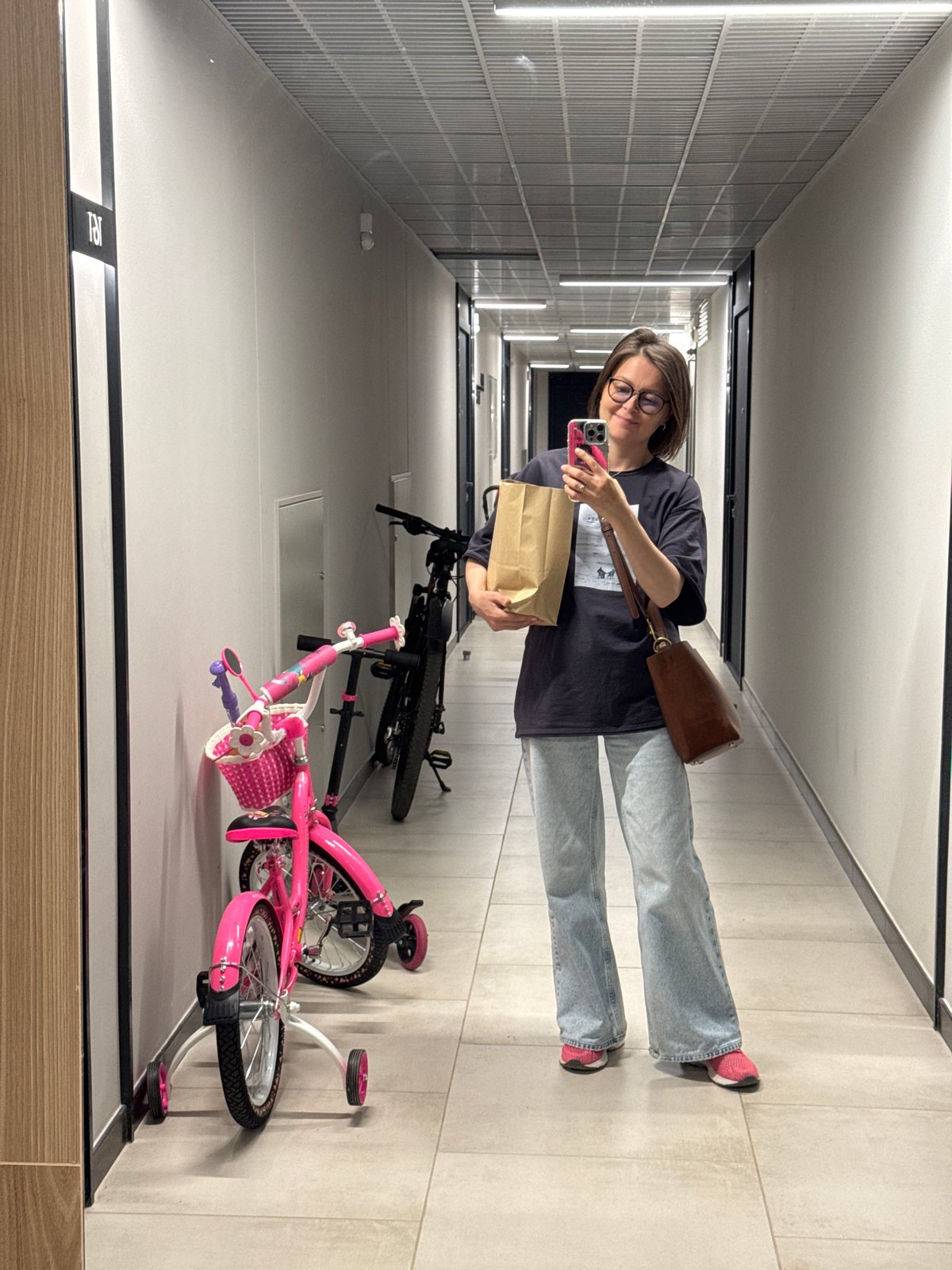 Arriving home in Izhevsk with flowers and a paper bag