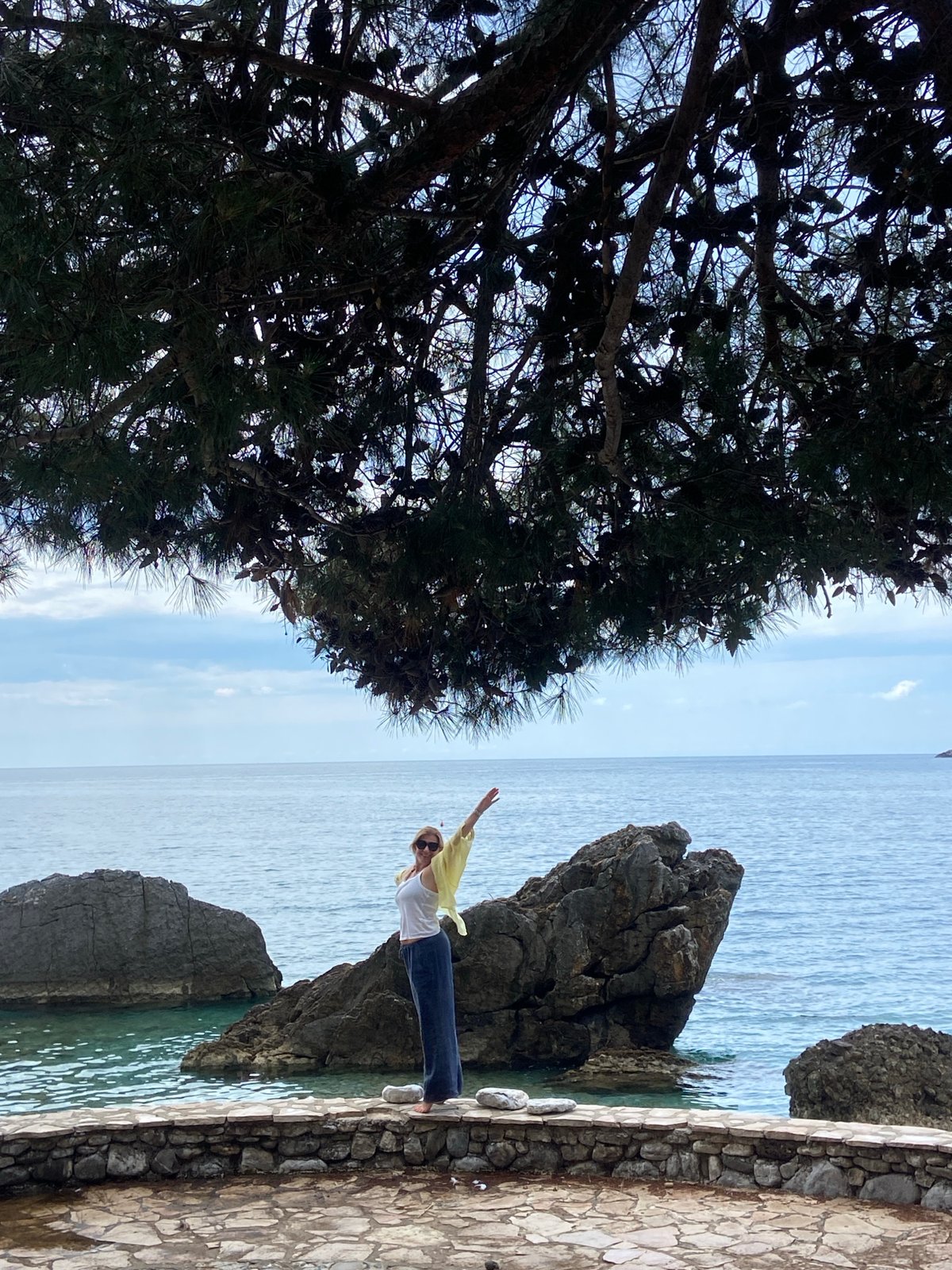 Woman spends morning posing, relaxing along Prijevor Montenegro coastline