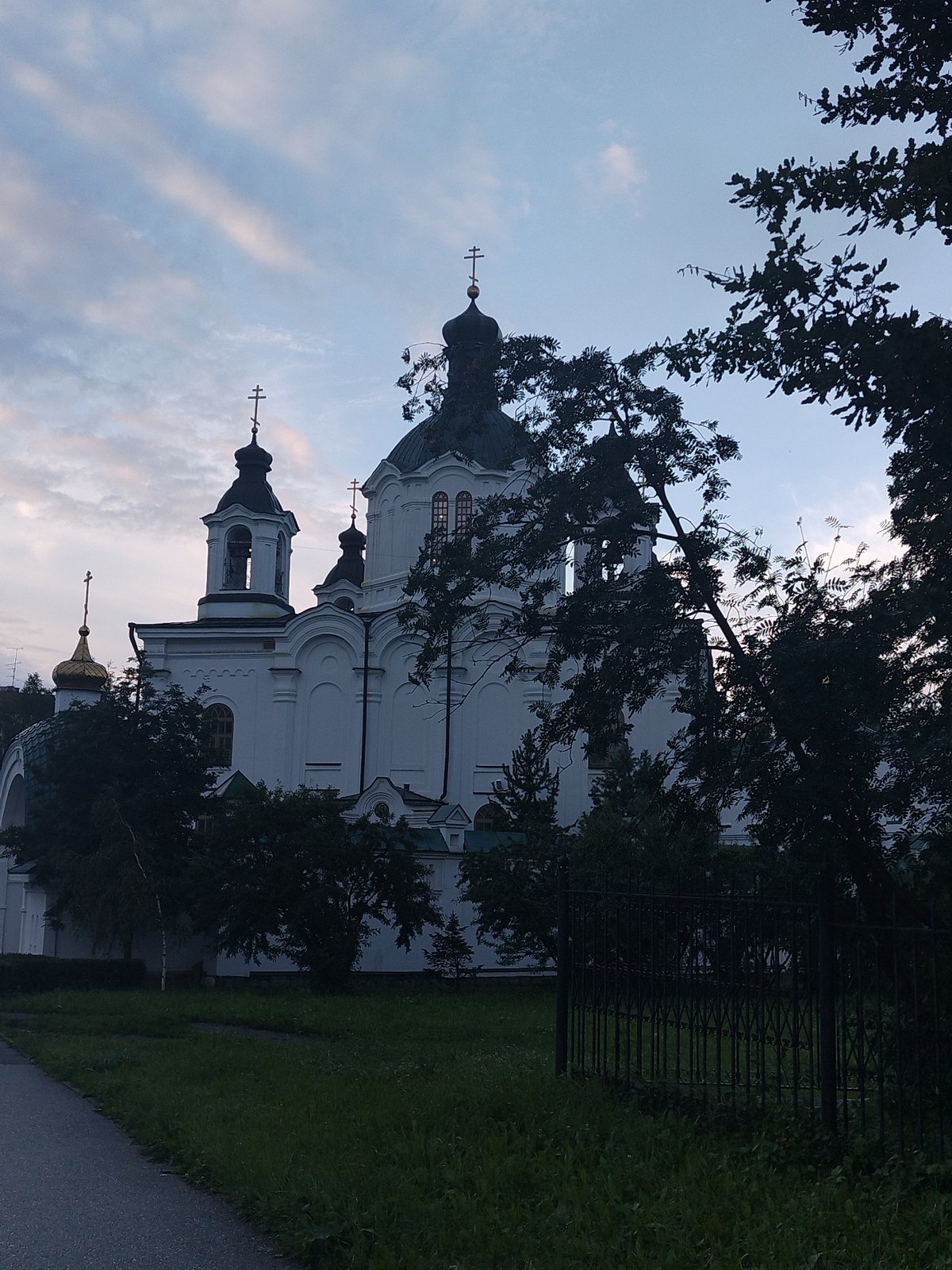 Church domes, a swollen river bridge, and a turreted building