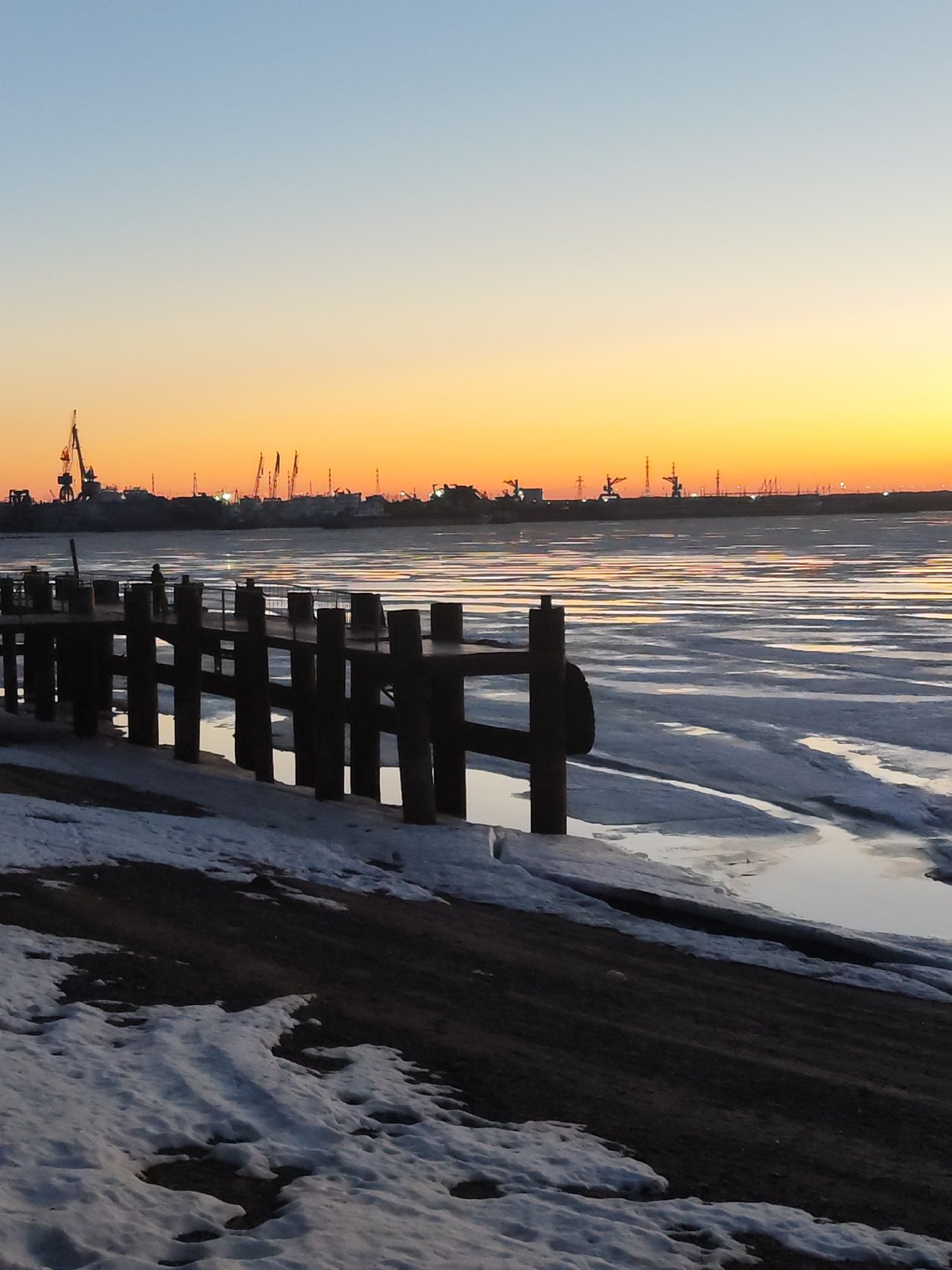 Winter sunset captured over Kama River in Chaikovsky, Russia