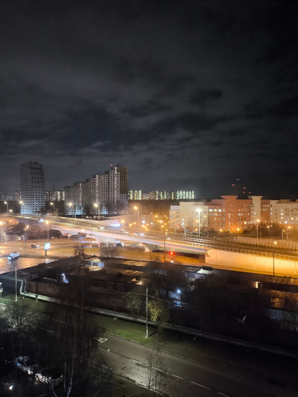 Moscow evening cityscape captured with lit buildings and overpass
