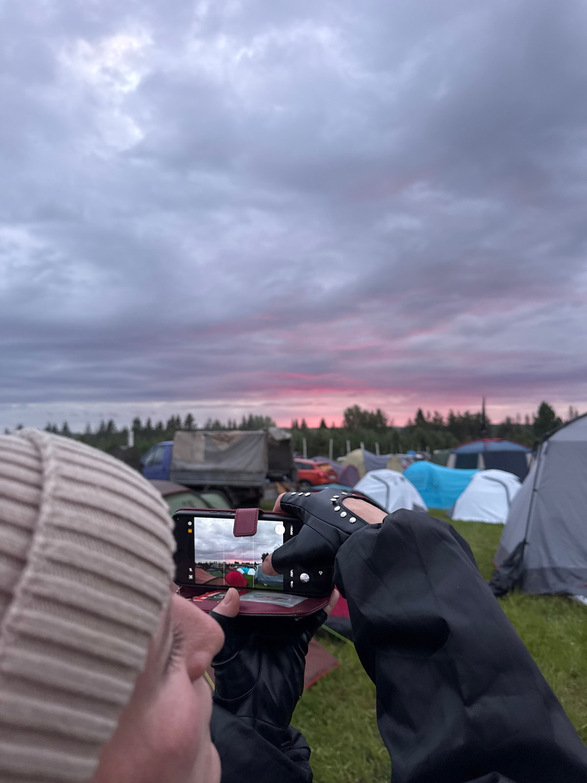 Outdoor festival with music, markets, campfires in rural Russia