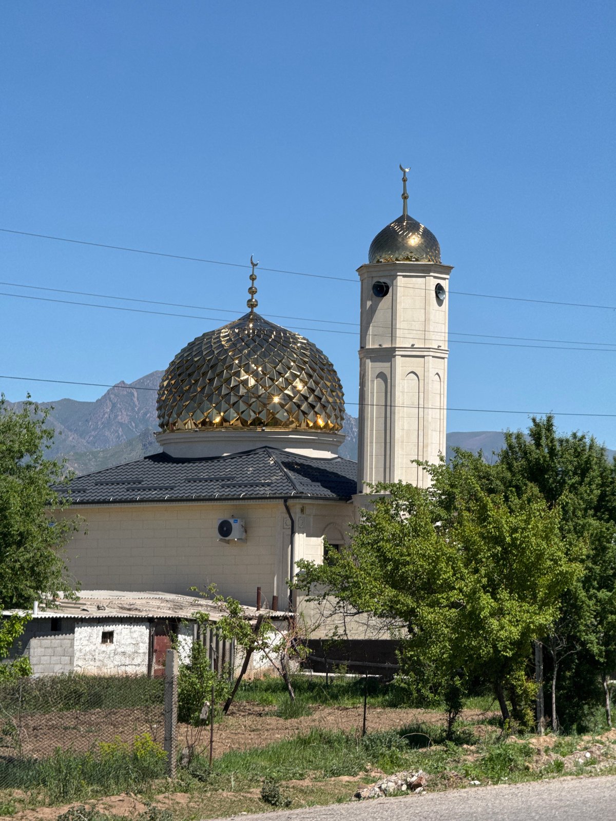 Mosque photographed under clear skies in Tokmok, Kyrgyzstan
