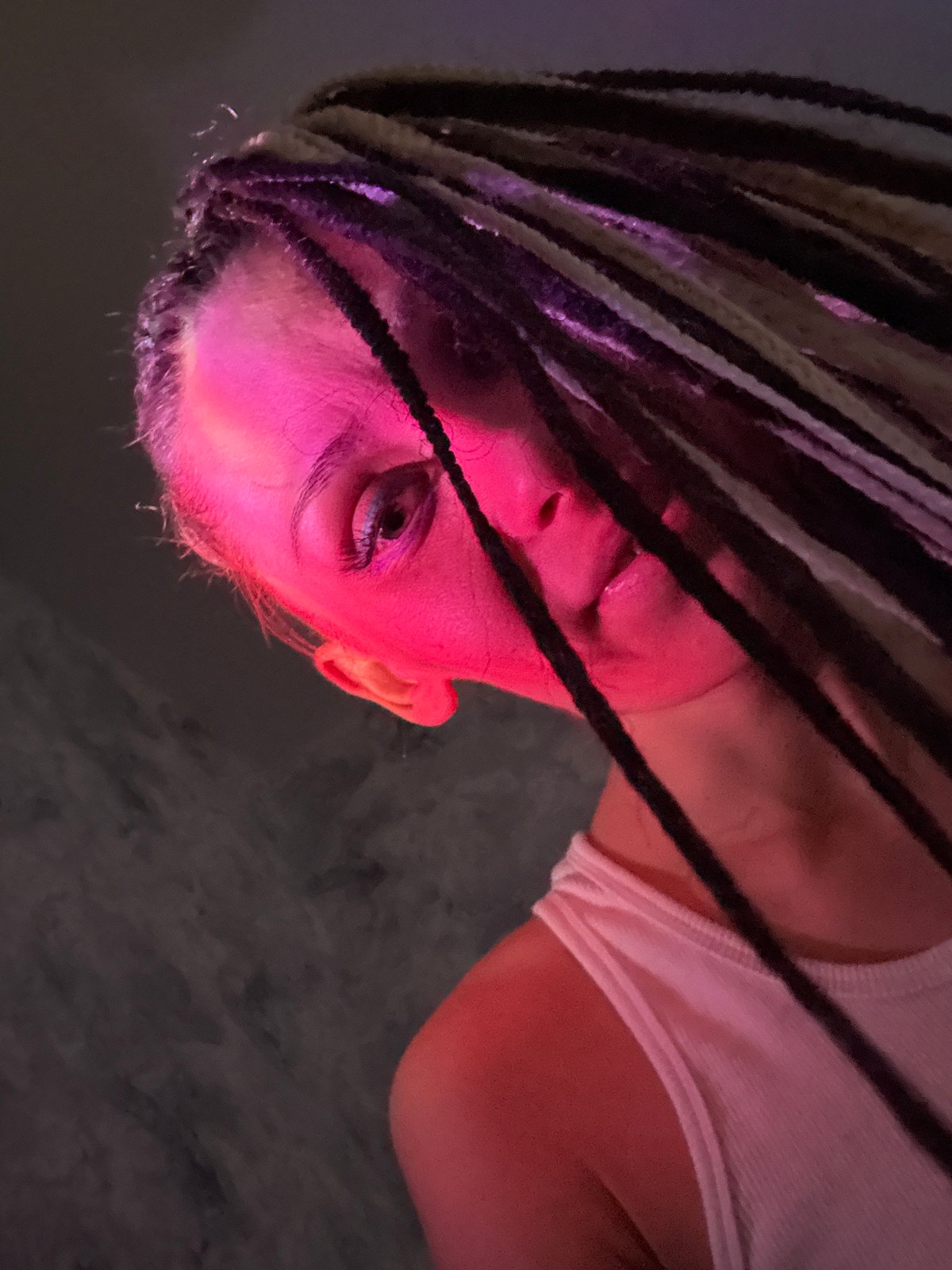 Person with braided hair photographed in Rusanovo, Russia