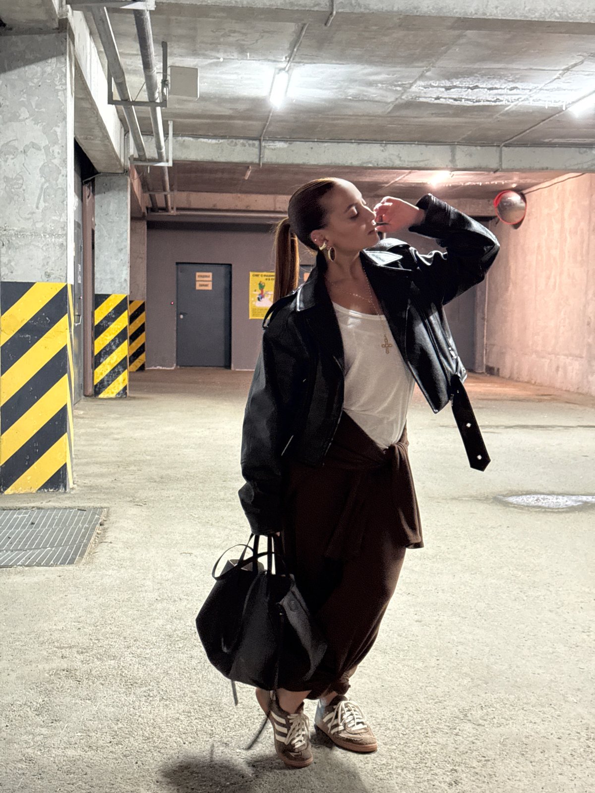 Woman photographs herself in Izhevsk building locations