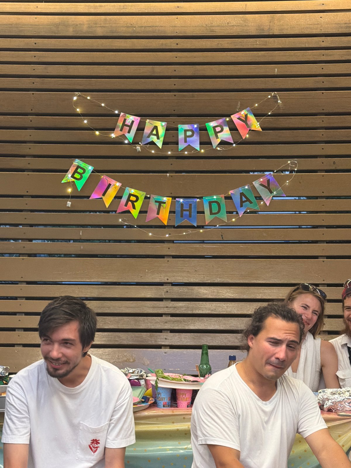 Outdoor birthday party under string lights in Tel Aviv