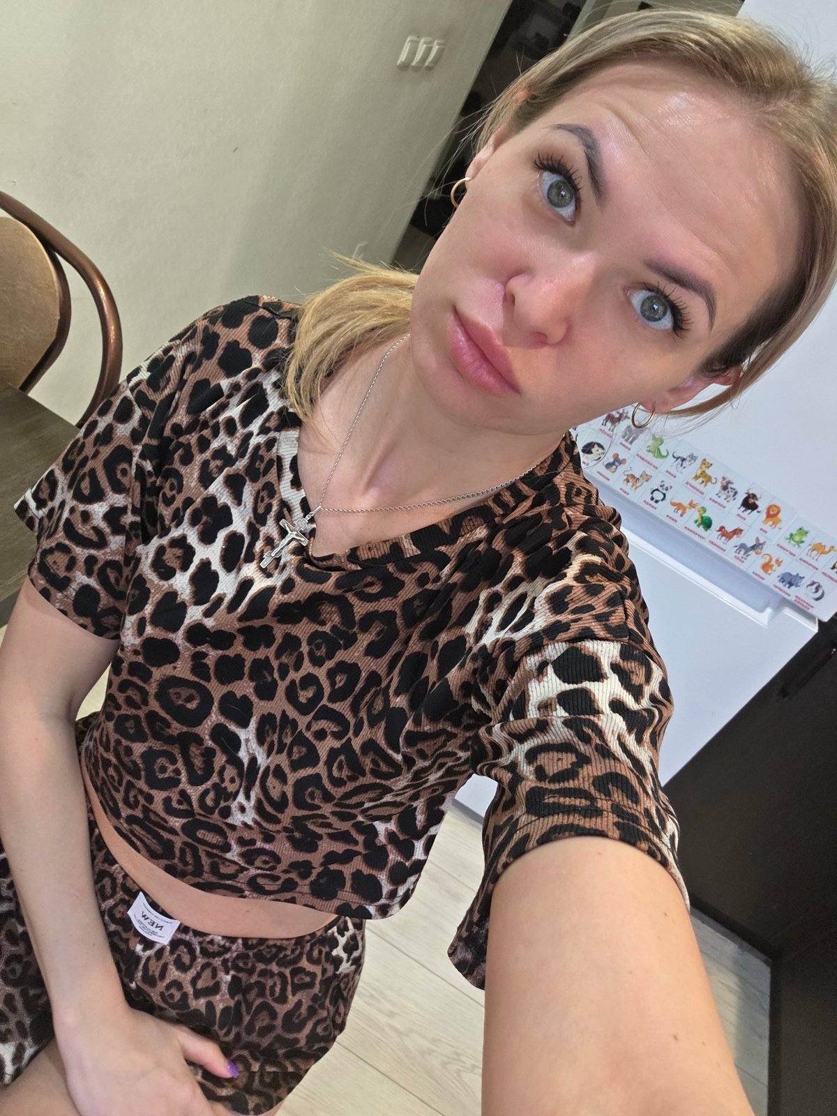 Woman takes selfie among houseplants in Chaikovsky home