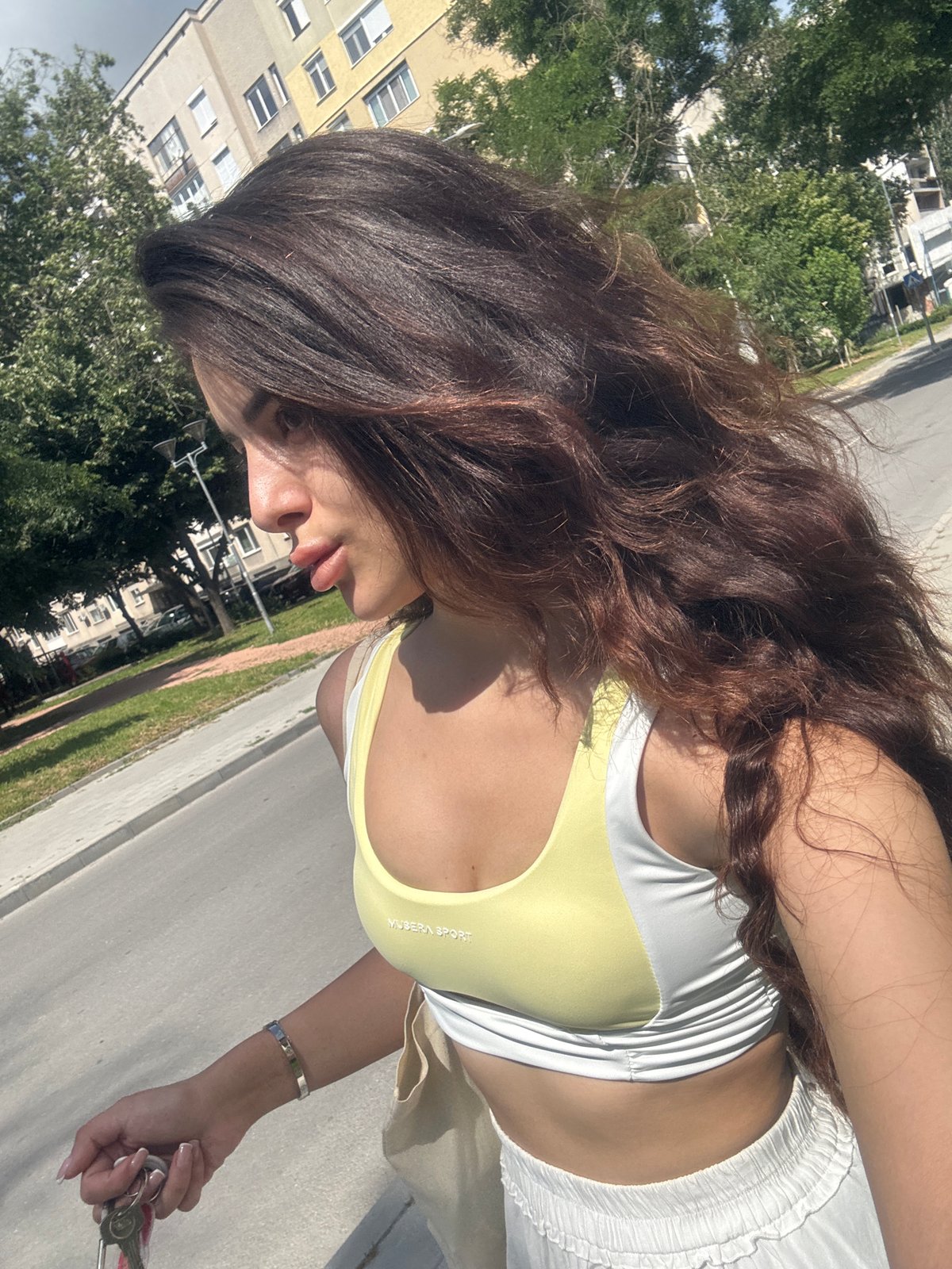 Woman photographed walking through Plovdiv city center in afternoon