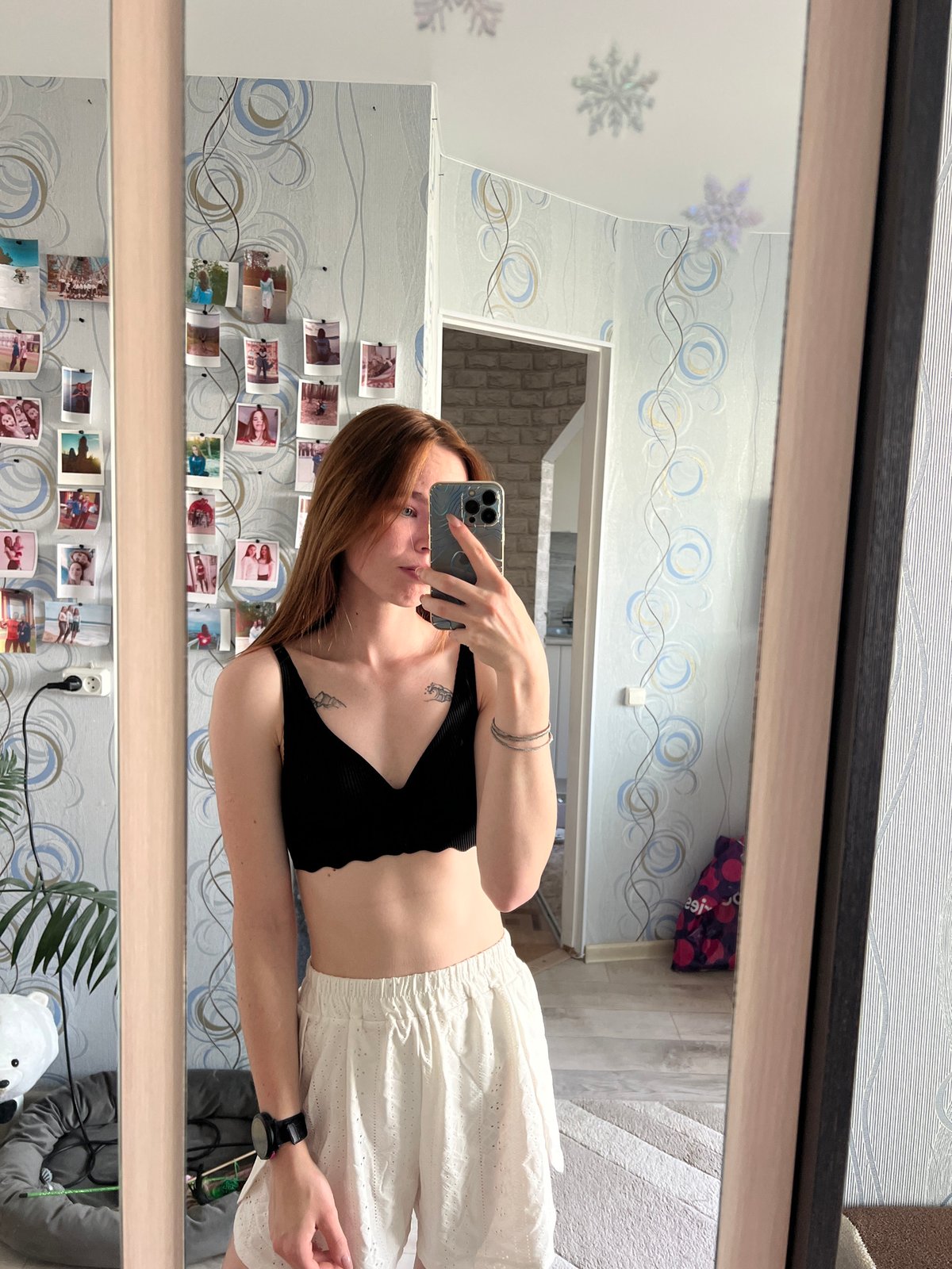 Woman takes mirror selfie in Chaikovsky home