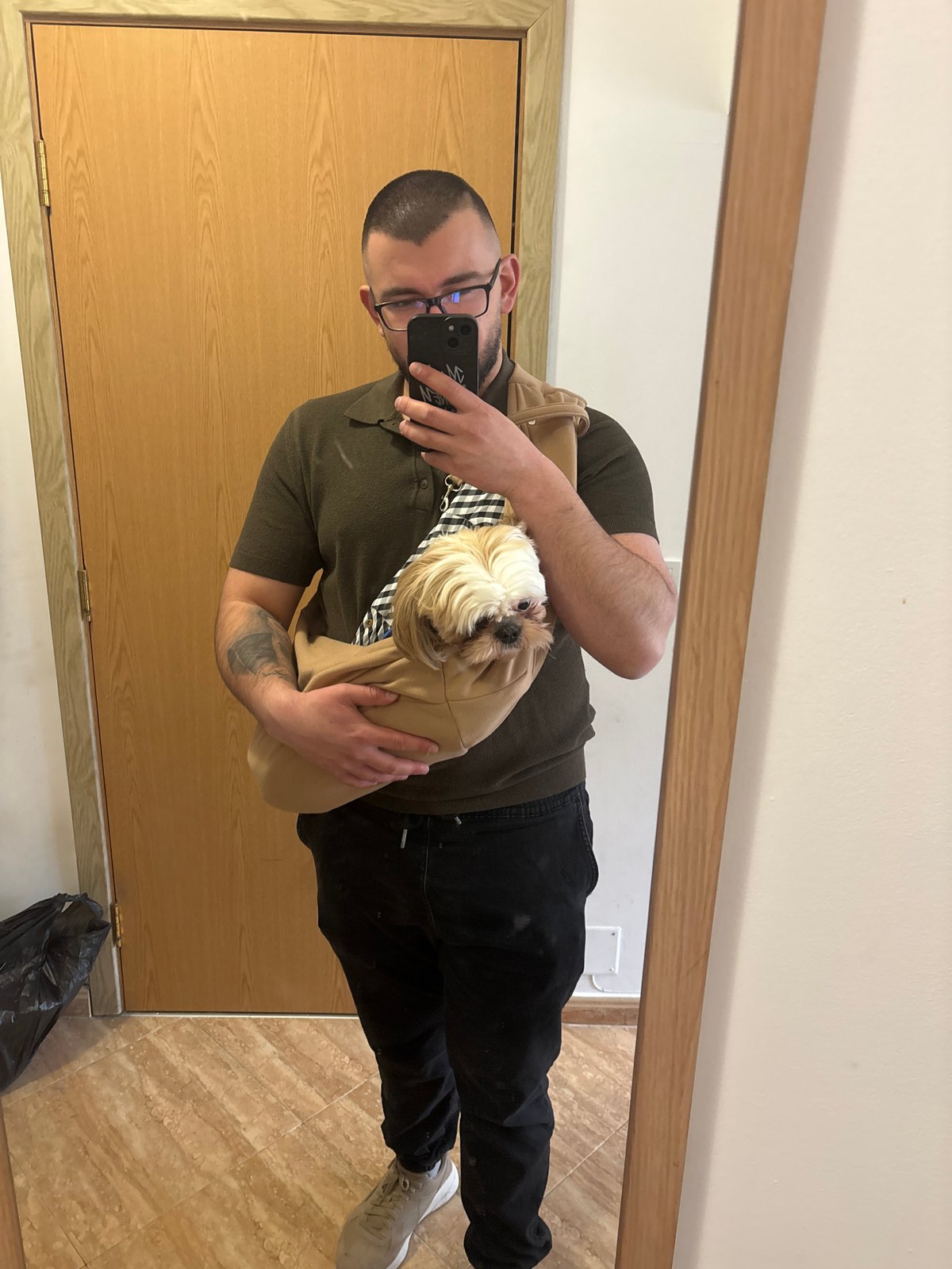 Man takes mirror selfies with small dog in Sofia