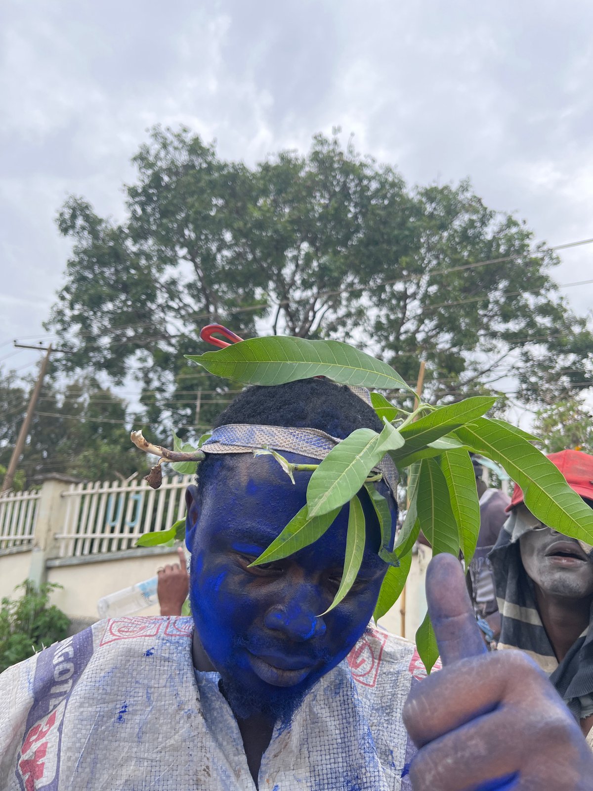 Blue body paint and costumes at a Jos street procession