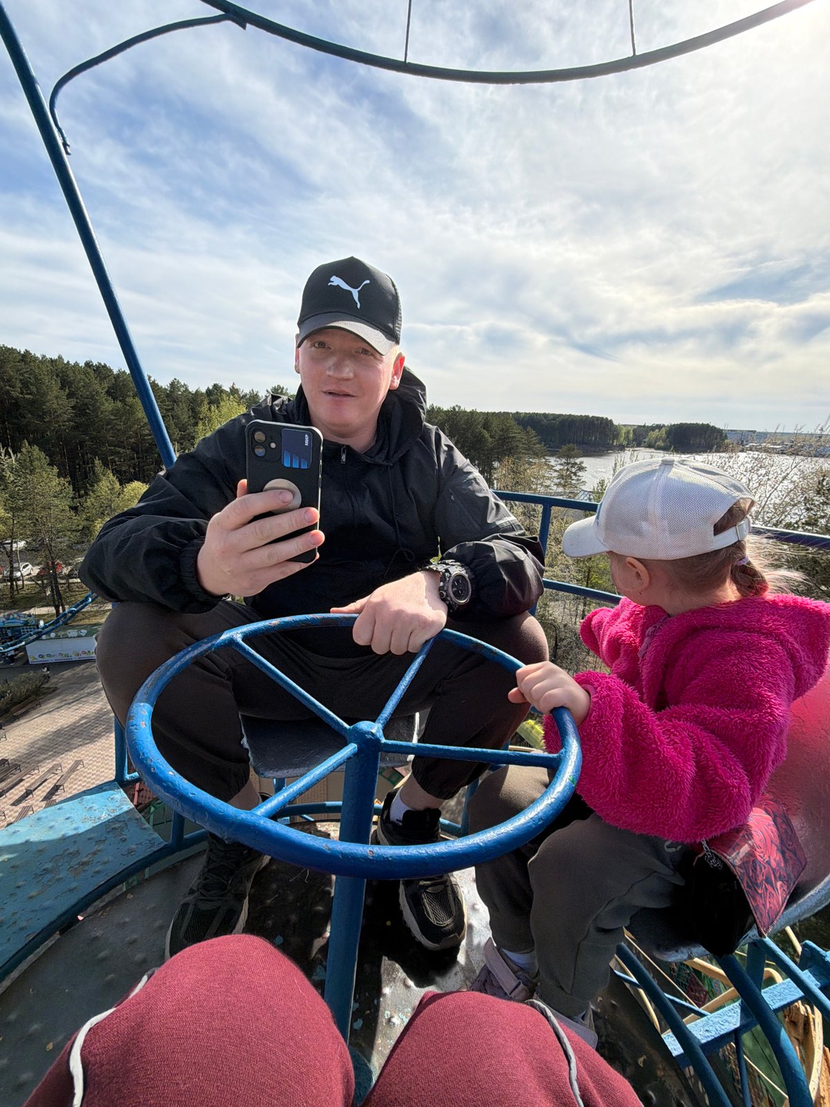 Families enjoy amusement park rides in Chaikovsky, Russia