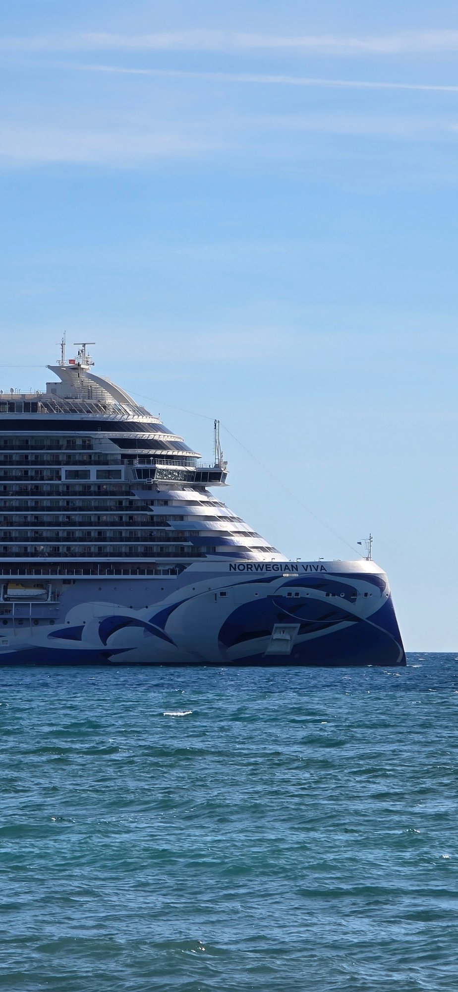 Cruise ship anchored off Bar Montenegro during busy afternoon