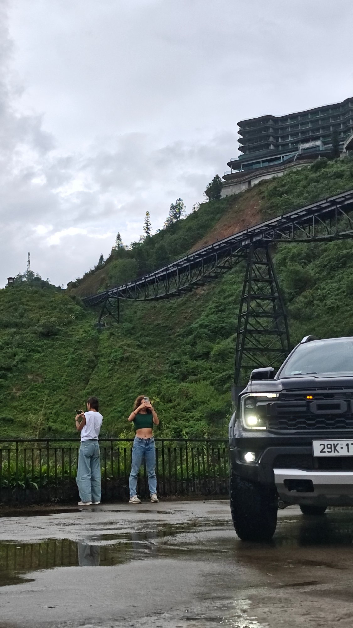 Tourists capture scenic mountain views at Vietnamese highland village