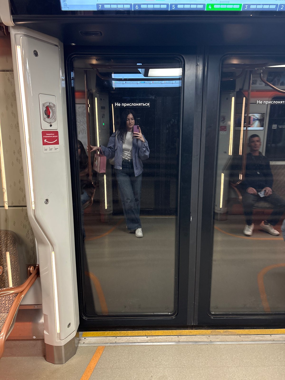 Woman takes selfie on Moscow Metro train