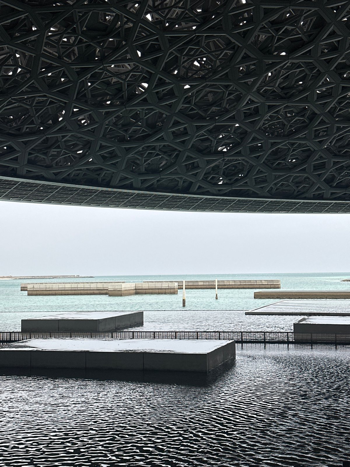Visitor explores Louvre Abu Dhabi's architecture and art displays