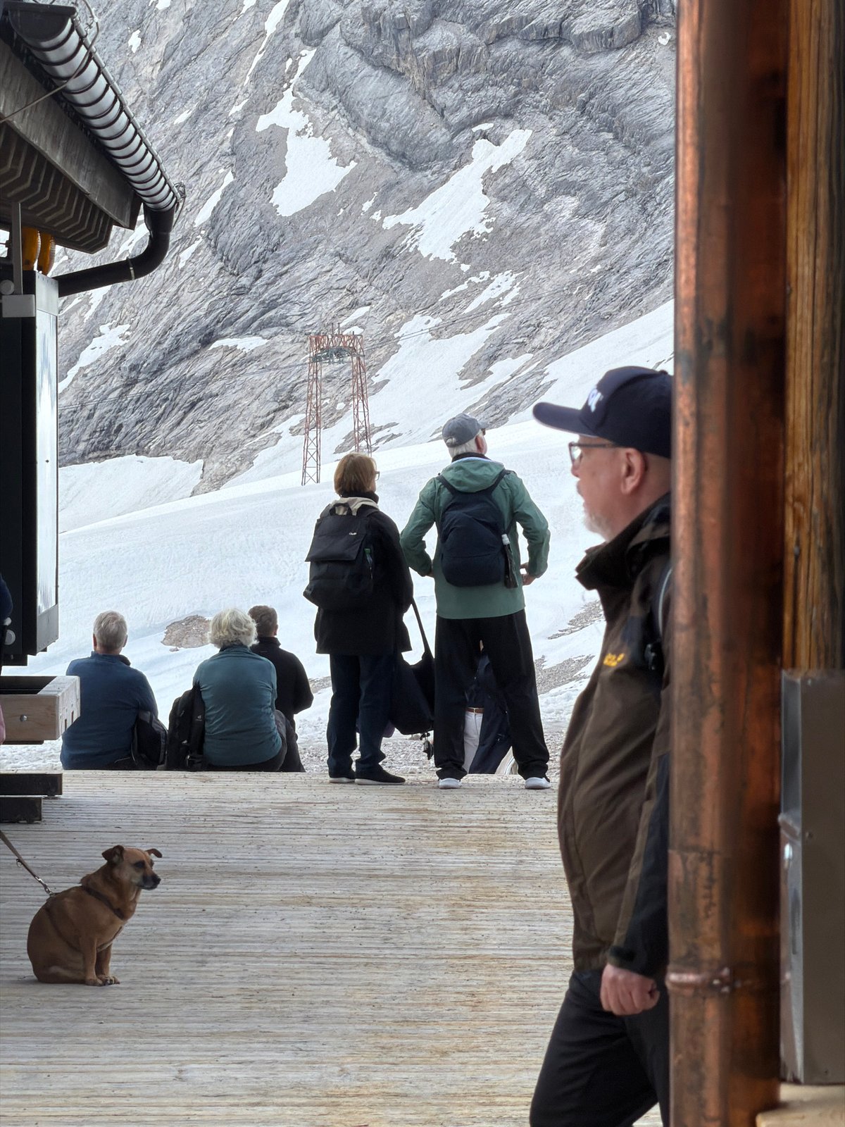 Visitors gather at Zugspitze summit restaurant amid Alpine views