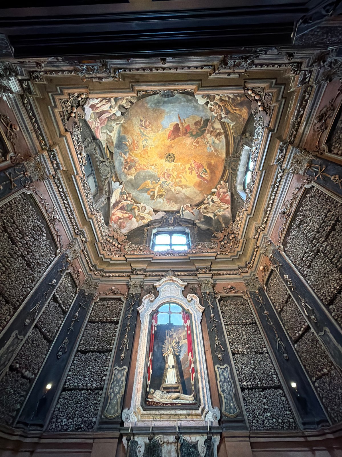 Tourist documents Milan's historic bone church and cathedral views