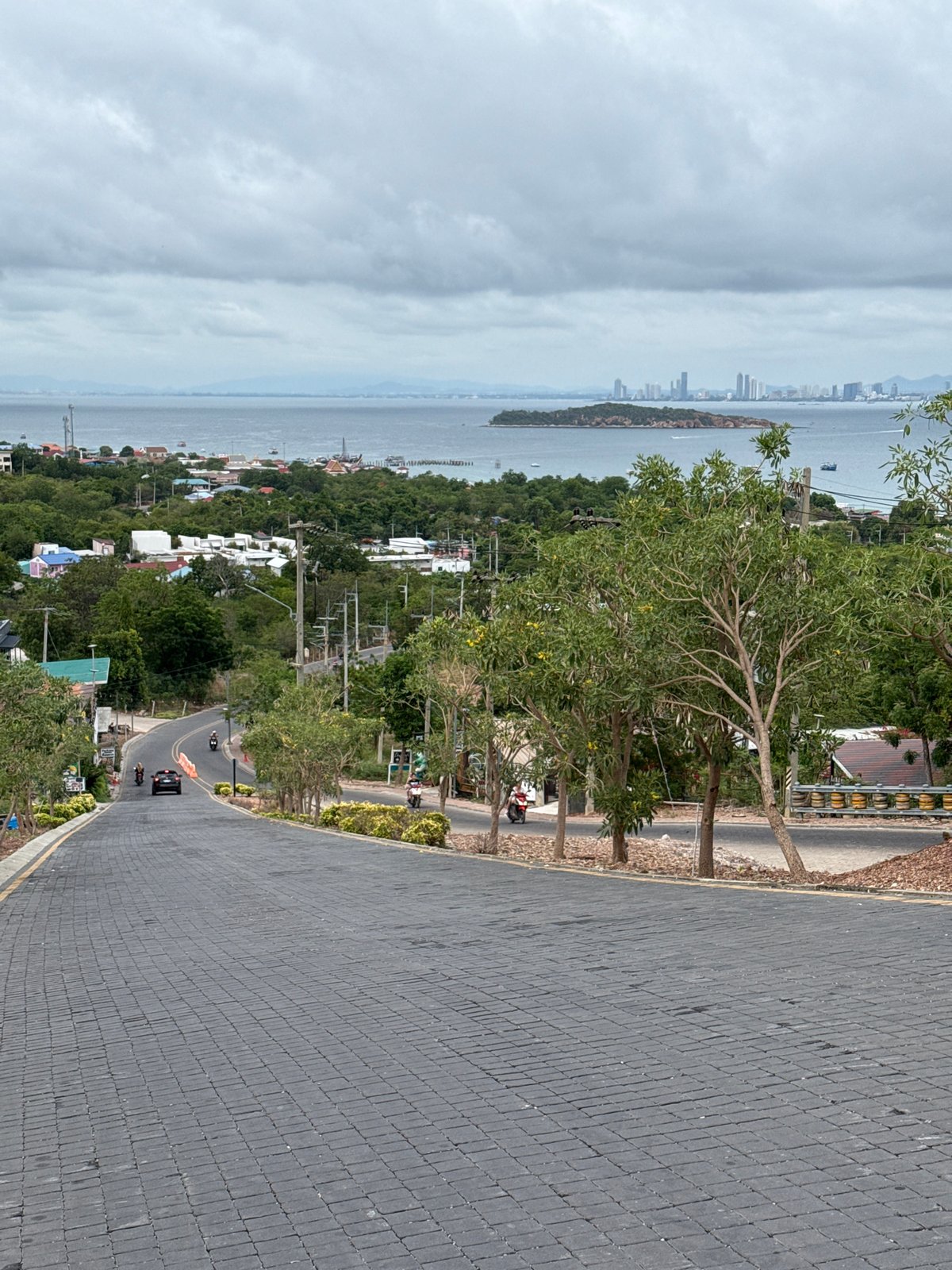Road view captures Pattaya coastline and skyline scene