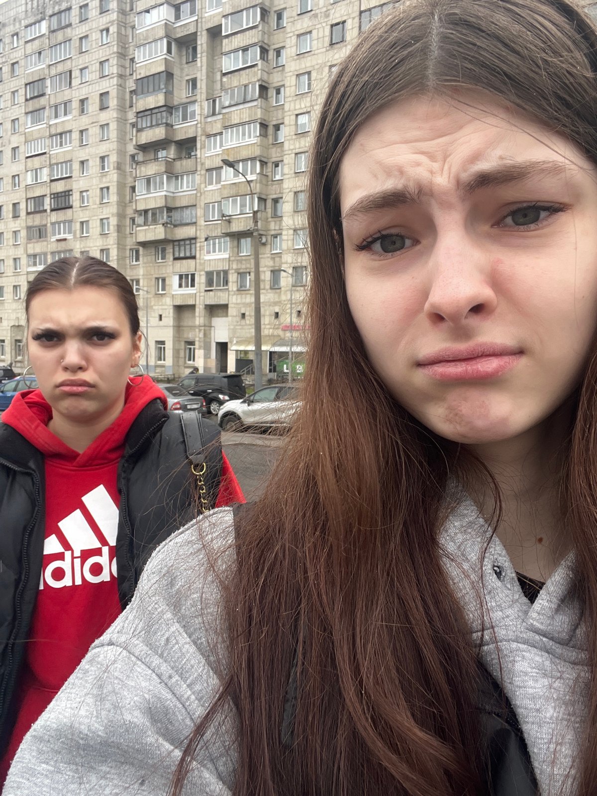 Groups take selfies near Saint Petersburg tram stop