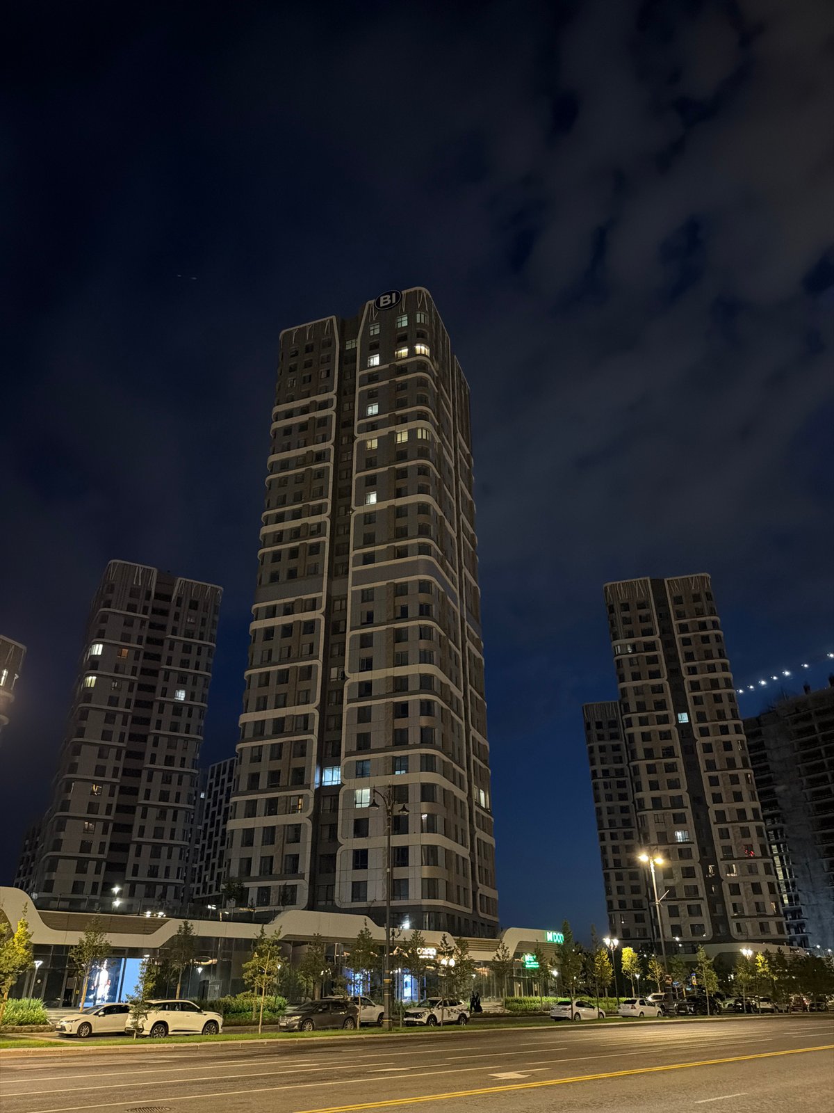 Astana's modern skyline at night, streets active