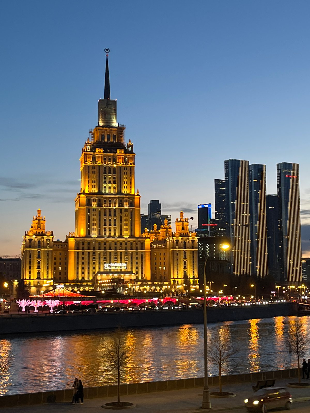 Moscow landmarks illuminated in golden and orange lights captured