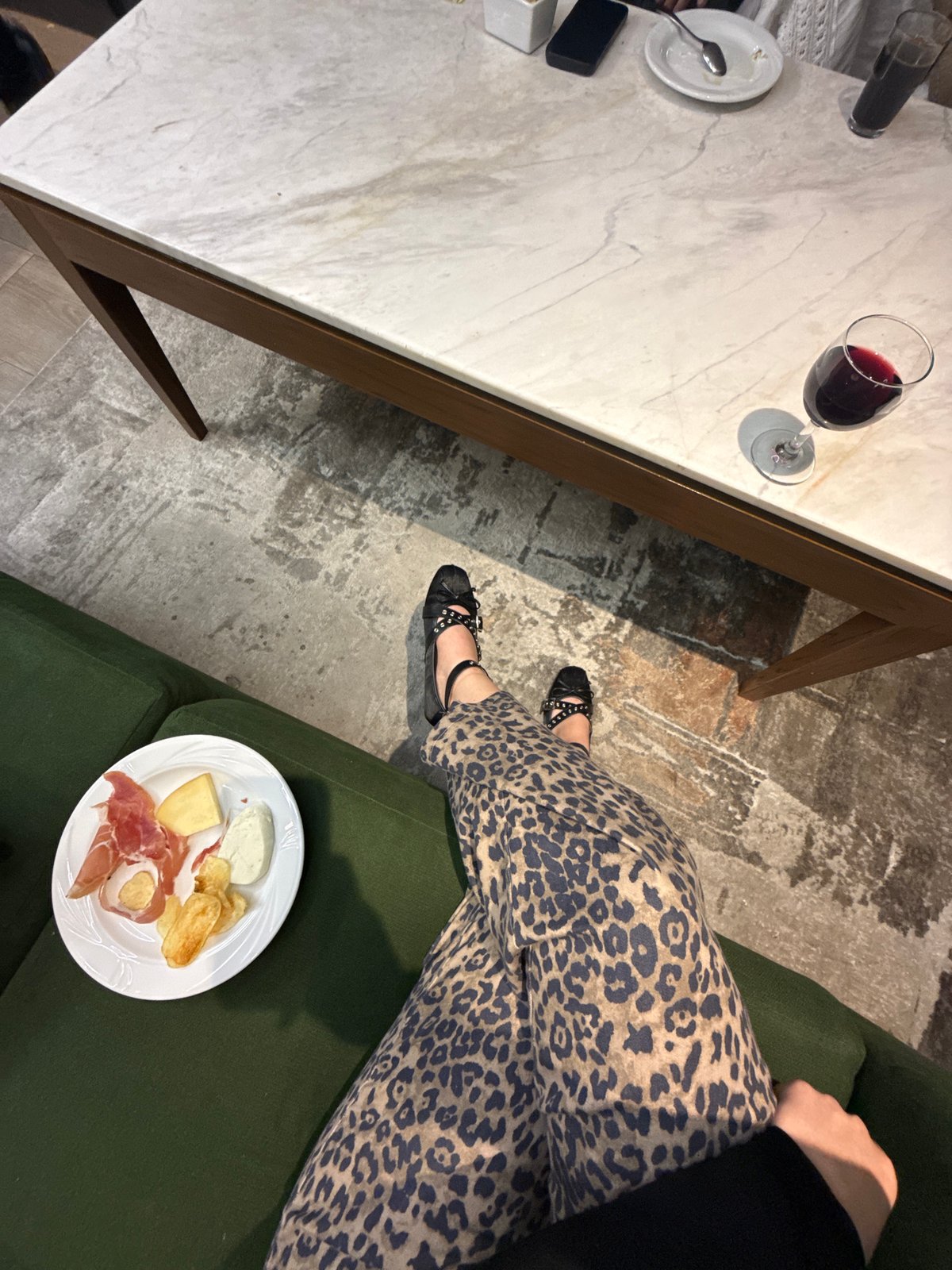 Woman enjoys wine and charcuterie evening at home in Mexico City