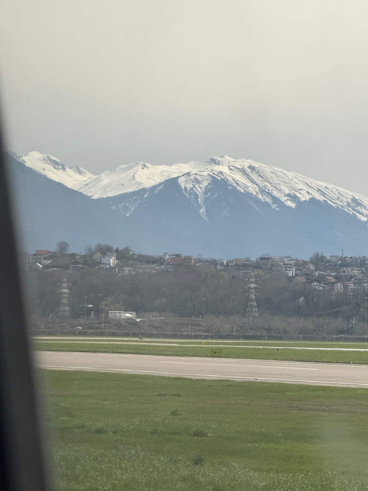 Aerial view captures Sochi's mountains and cityscape