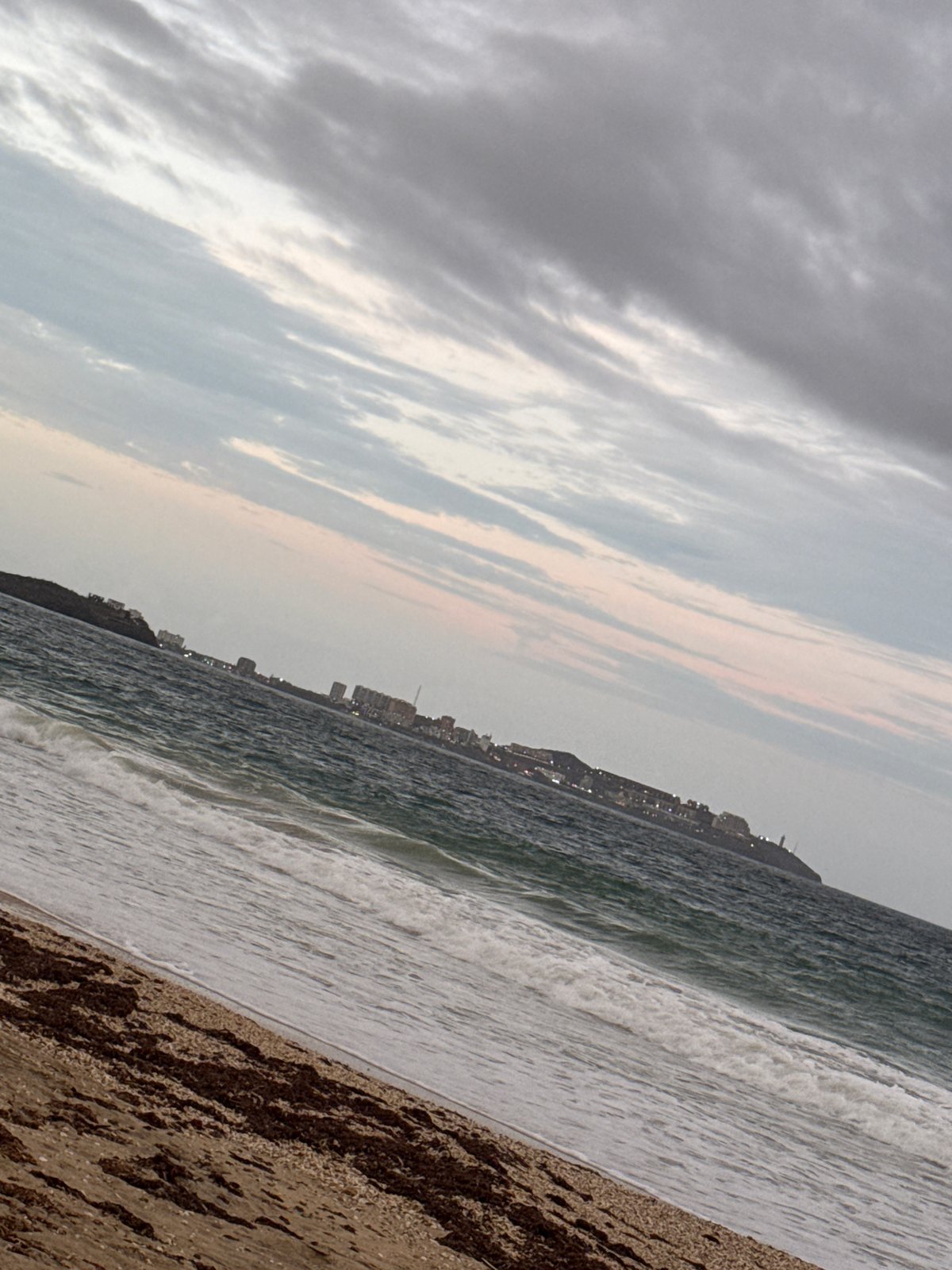 Photographer documents overcast beach scene in Porlamar, Venezuela