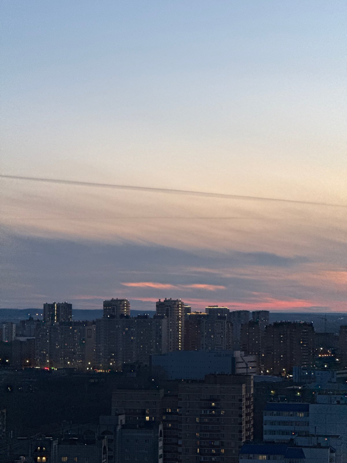 Twilight descends over Perm cityscape, captured by observers