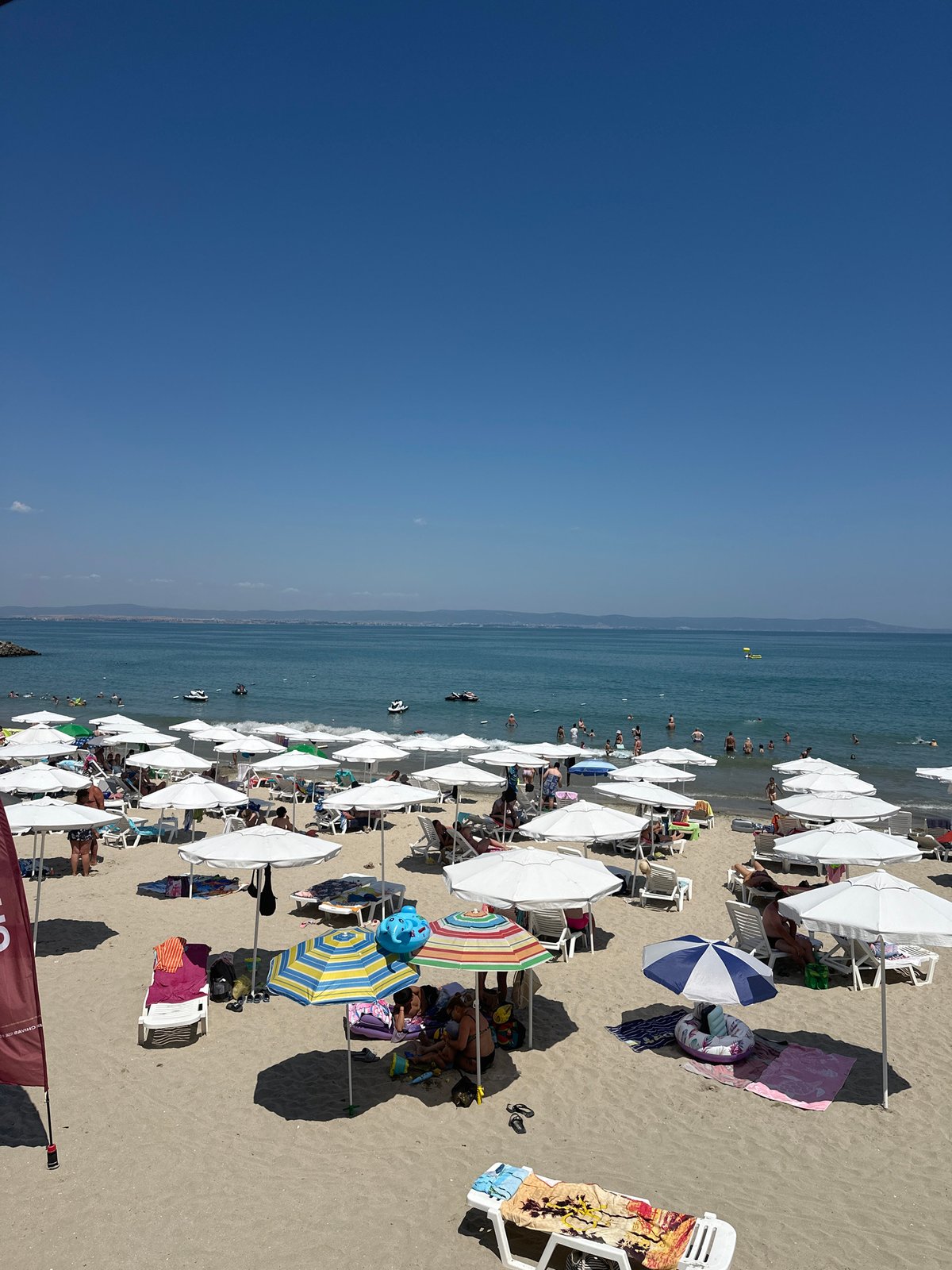 Packed summer beach day in Pomorie, Bulgaria