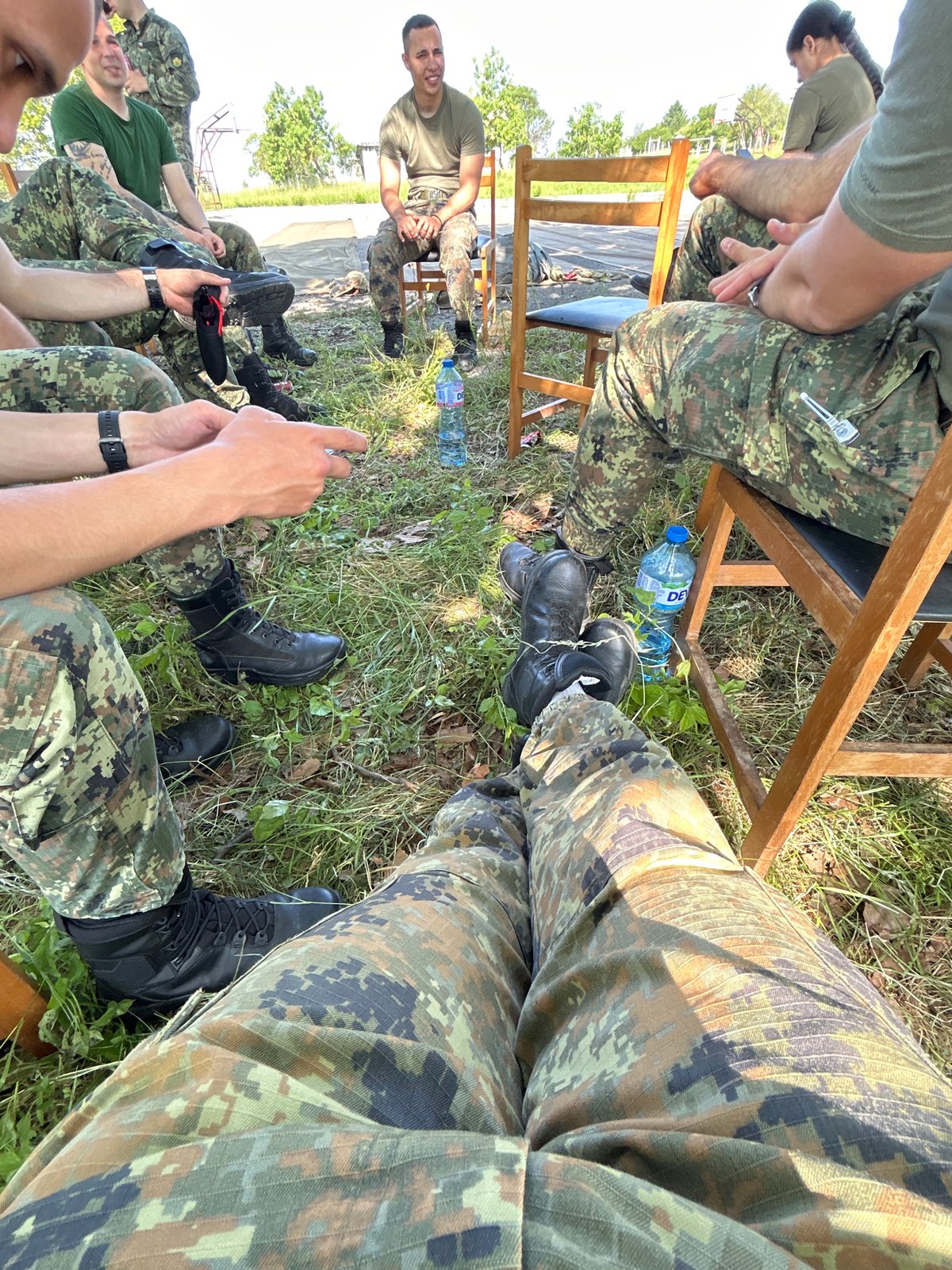 Military-dressed group gathers at outdoor facility in Bulgaria