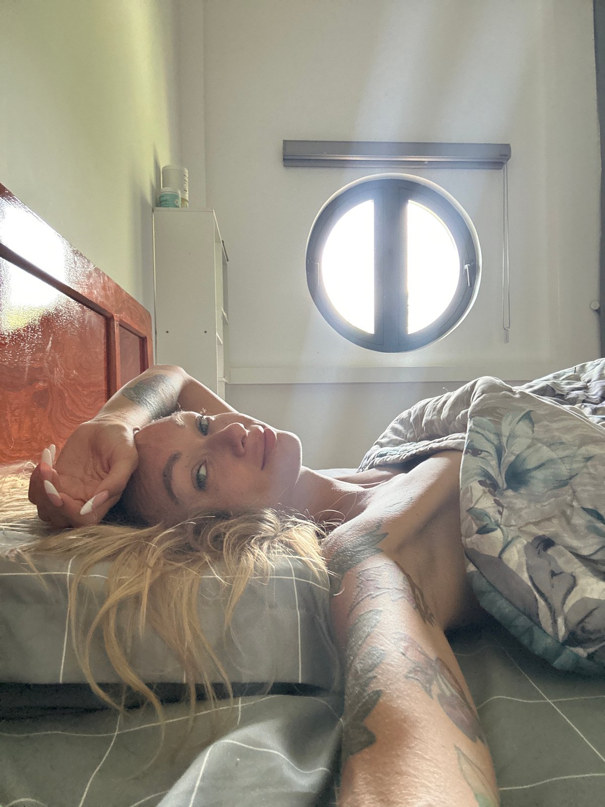 Woman resting in bedroom captured in Mũi Né morning
