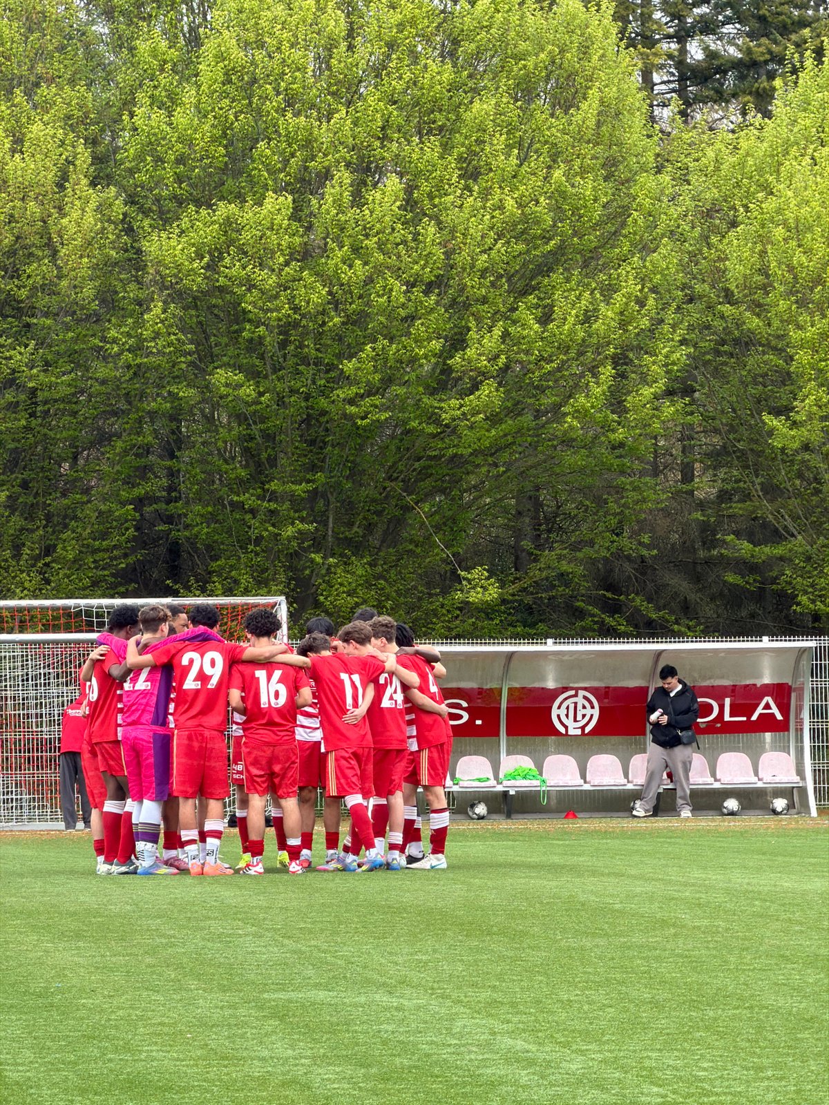 Spring day scenes captured at Luxembourg sports stadium