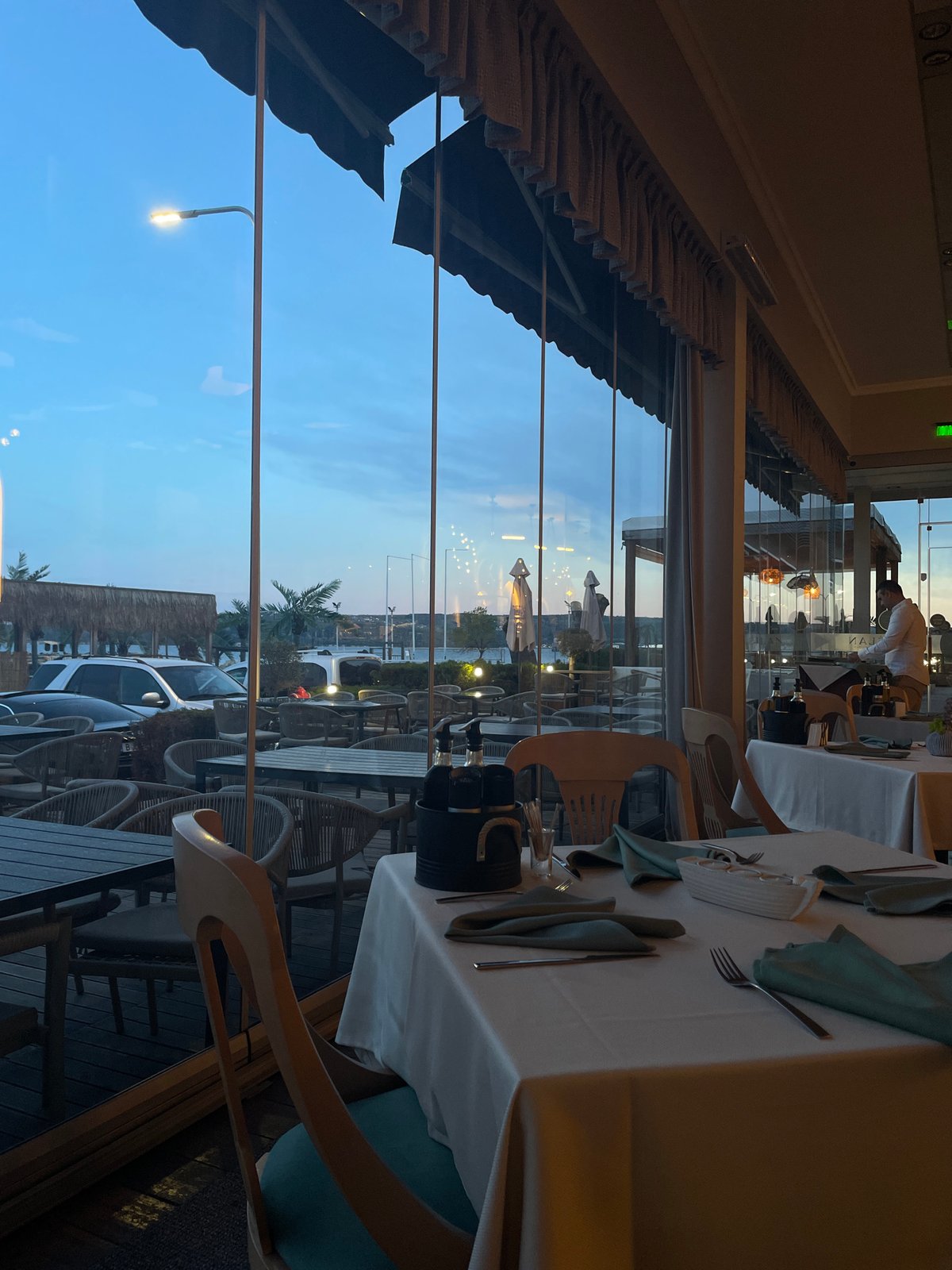 Restaurant dining room observed at dusk in Varna