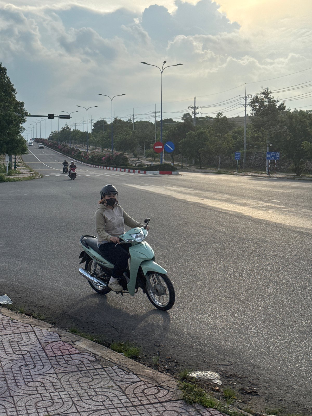 Morning scooter traffic flows through Mũi Né streets