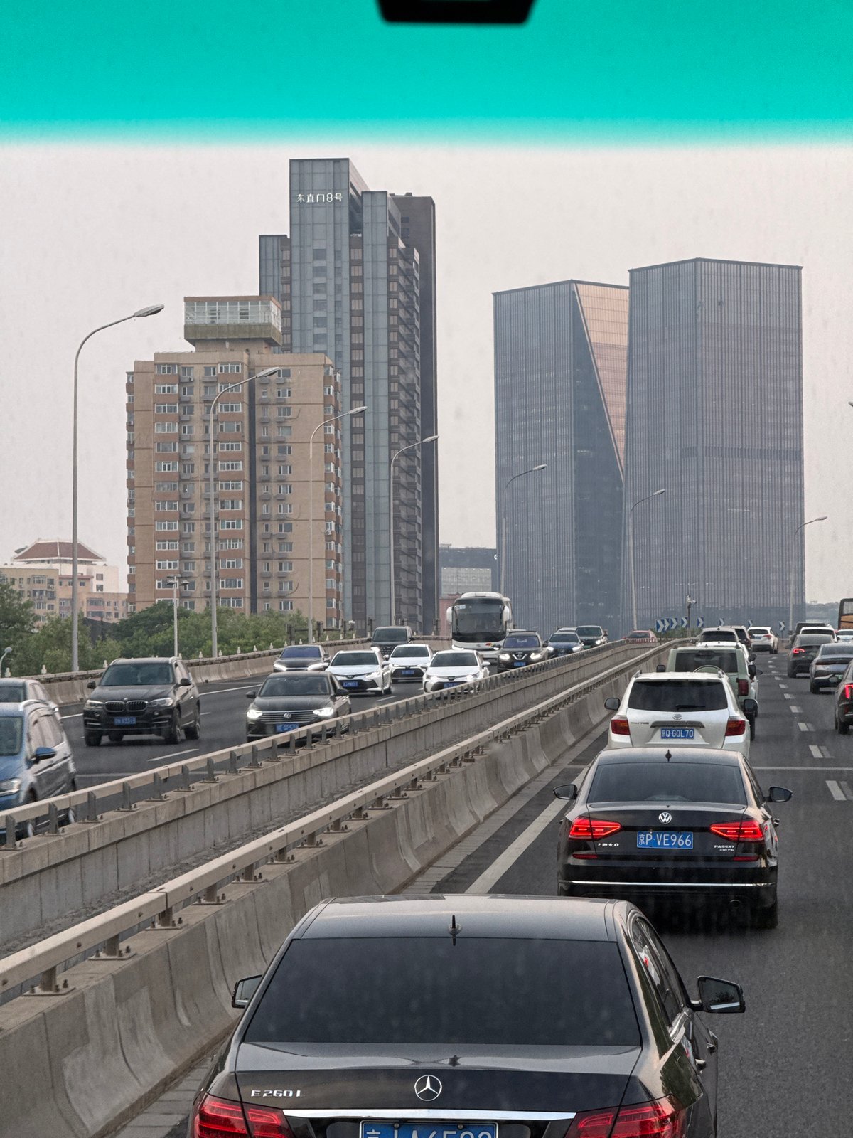 Beijing traffic crawls under orange morning sky across districts