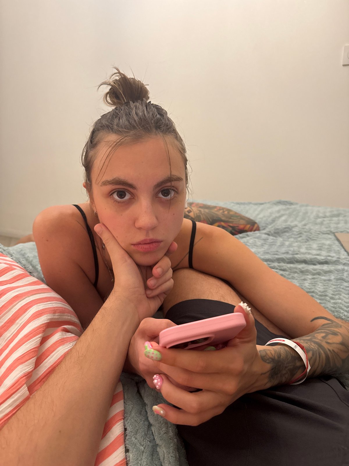 Lazy evening at home: phone in bed, bathroom selfie