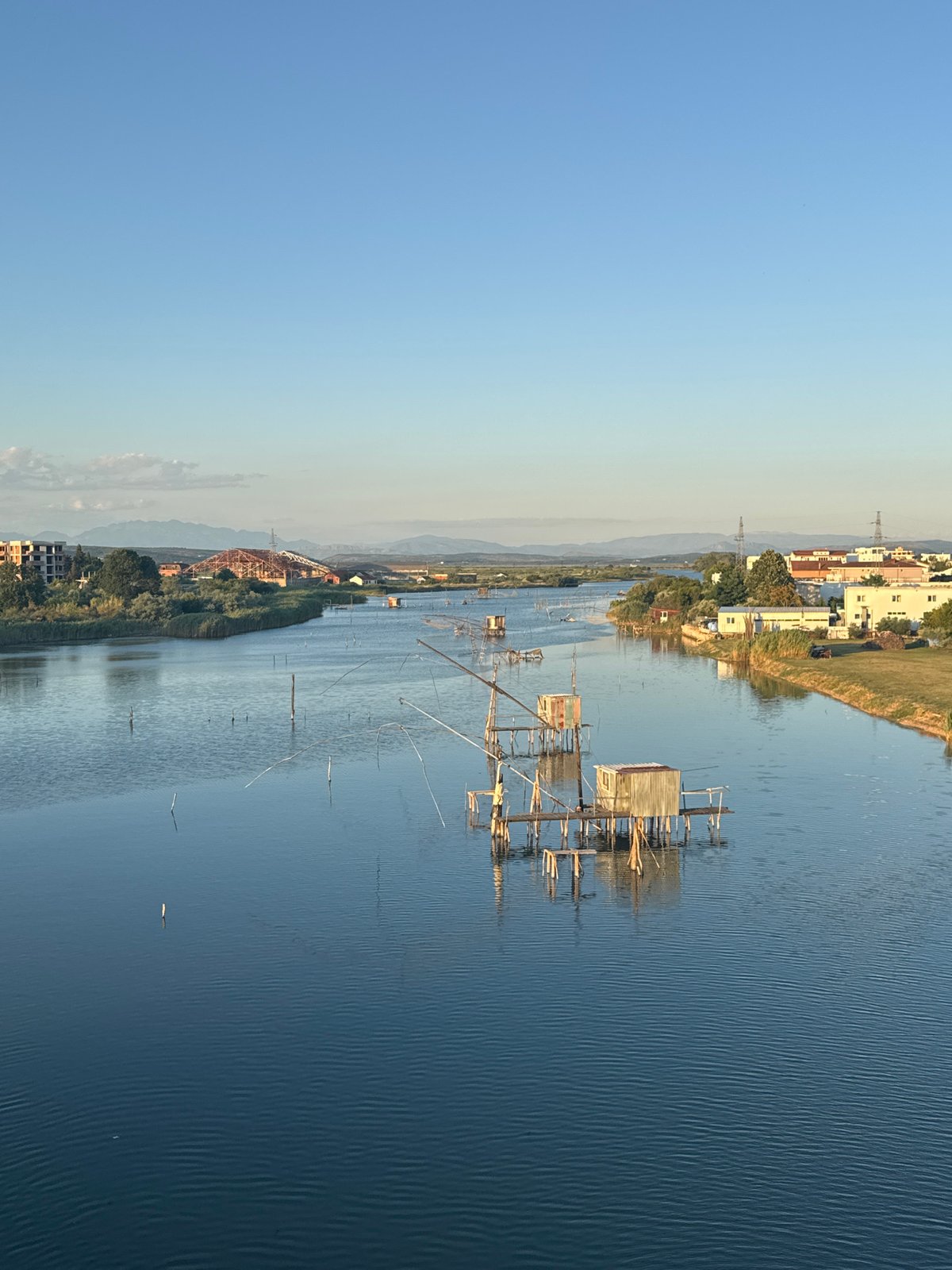 Ulcinj at golden hour: fishing waters and a coastal sunset road