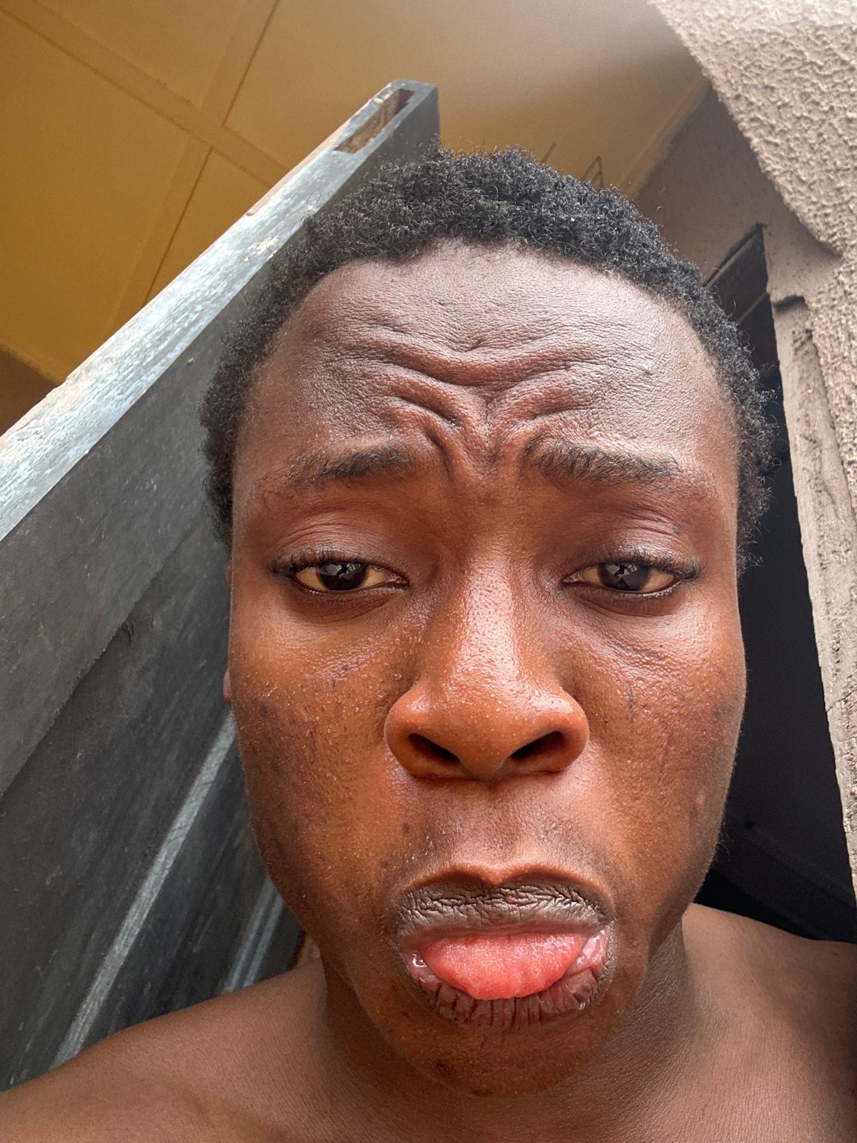 Person captured making varied expressions in 14 photos