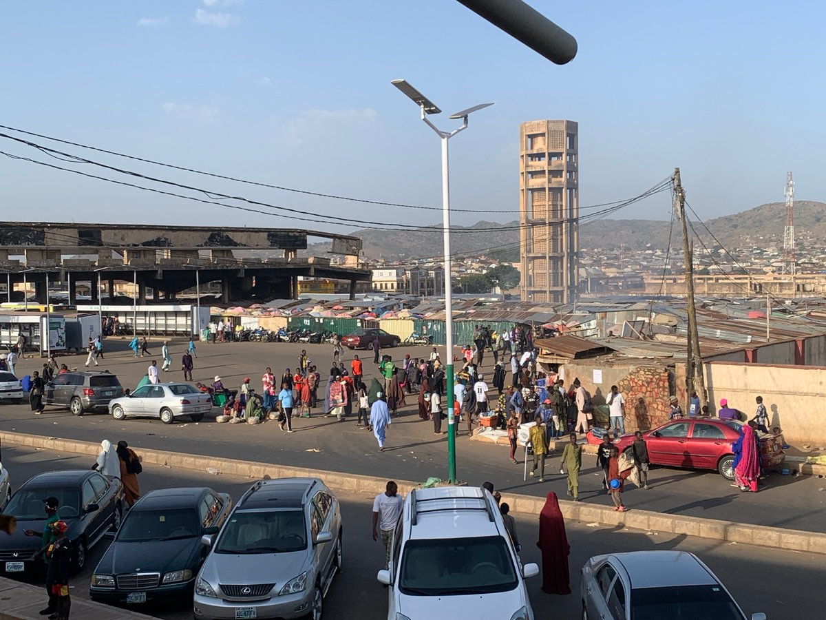 Ordinary afternoon life documented across Jos marketplace and shops