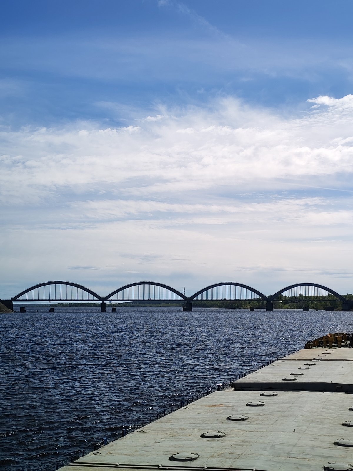 Multi-arch bridge spans water in Krasnyi Rybak, Russia