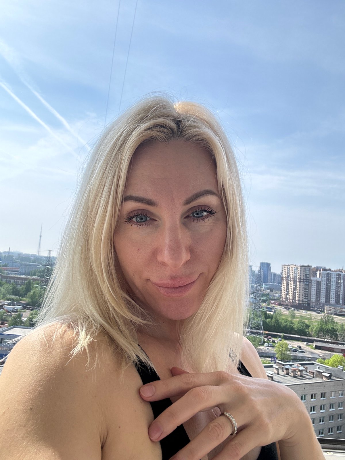 Urban routine: selfies and lawn care captured simultaneously
