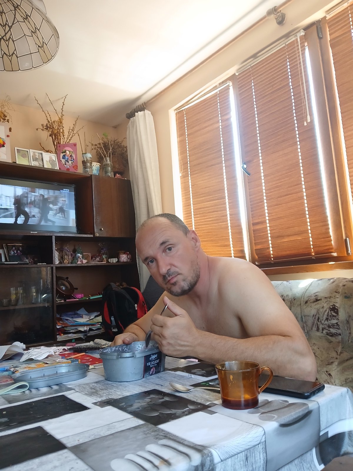 Man enjoys ice cream breakfast with panda in Bulgaria