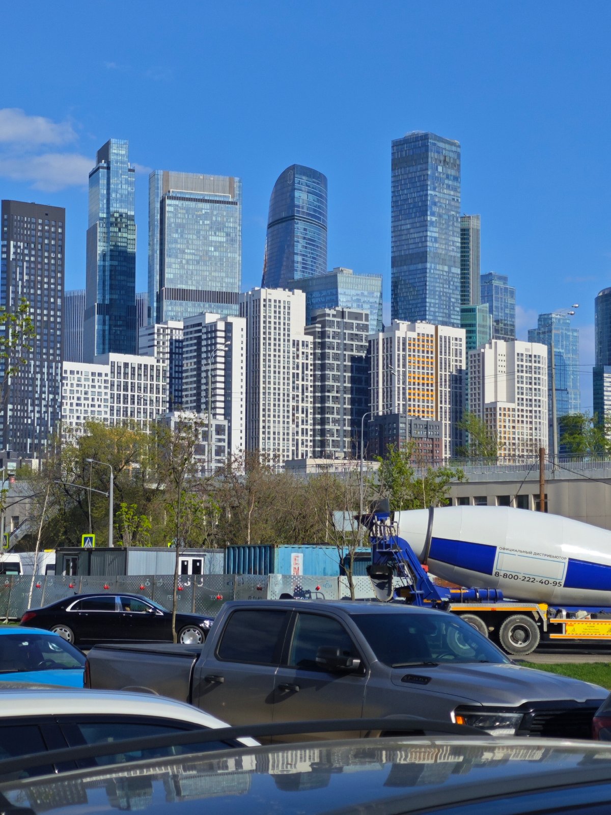 Concrete mixer truck spotted among parked vehicles in Moscow