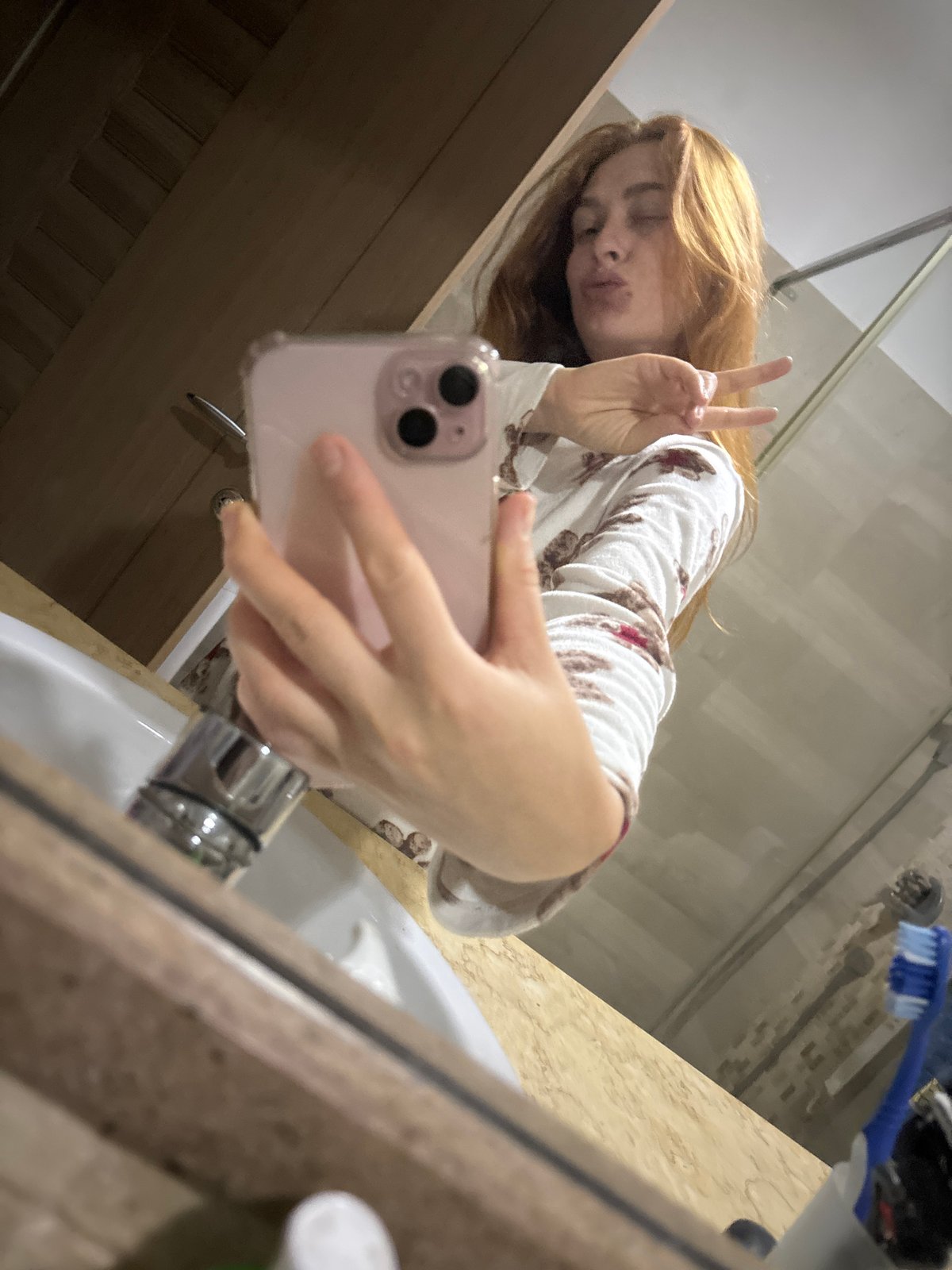 Woman takes bathroom selfies in pajamas in Montenegro