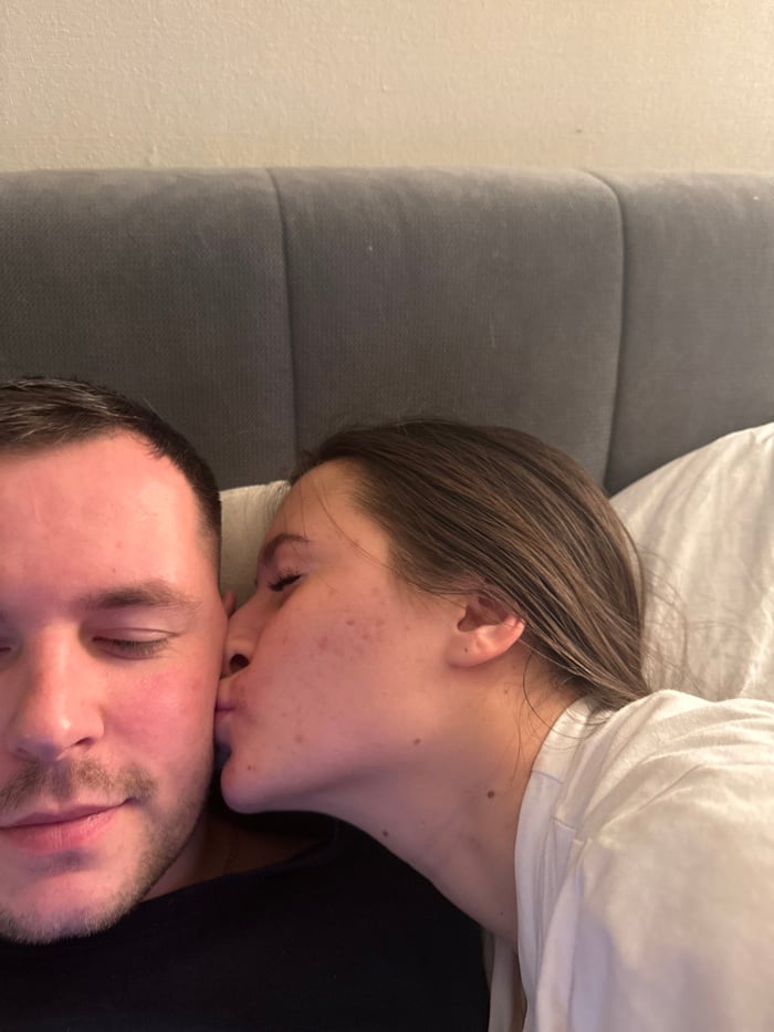 Couple enjoys quiet evening at home with cat in Odintsovo