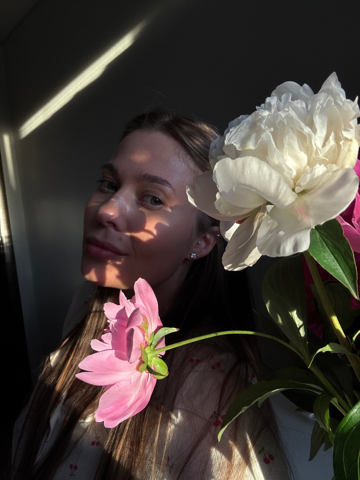 Afternoon at home in Chernushka: peonies, a cat, and soft light