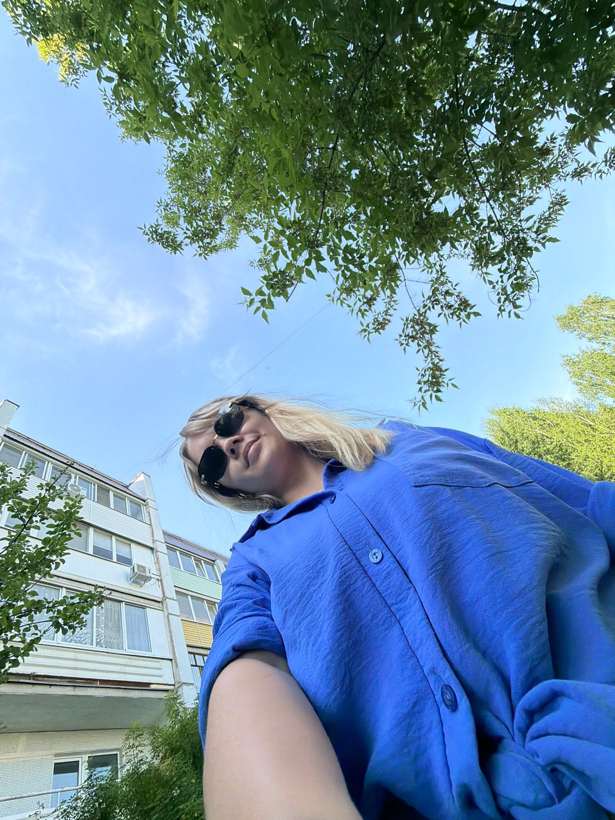 Woman documents spring afternoon with selfies and flowers in Chaikovsky