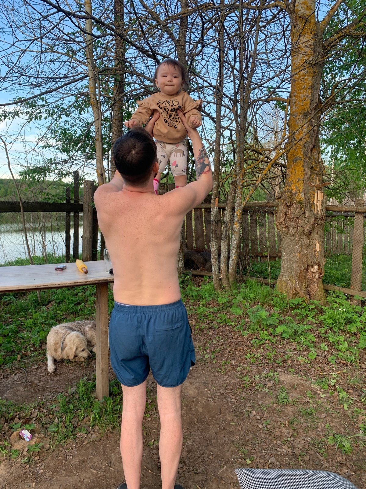 Family lakeside gathering features swimming, music, dining in Zasechnyi